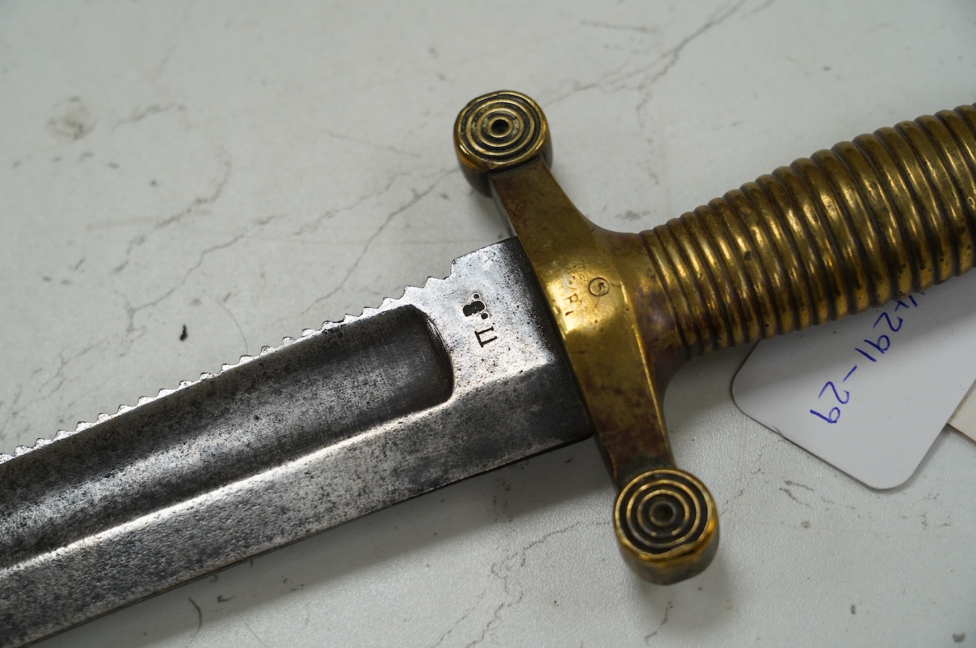 An 1847 Russian pioneer short sword, based on the French 1831 Gladius, with saw back edge, blade 48cm. Condition - good